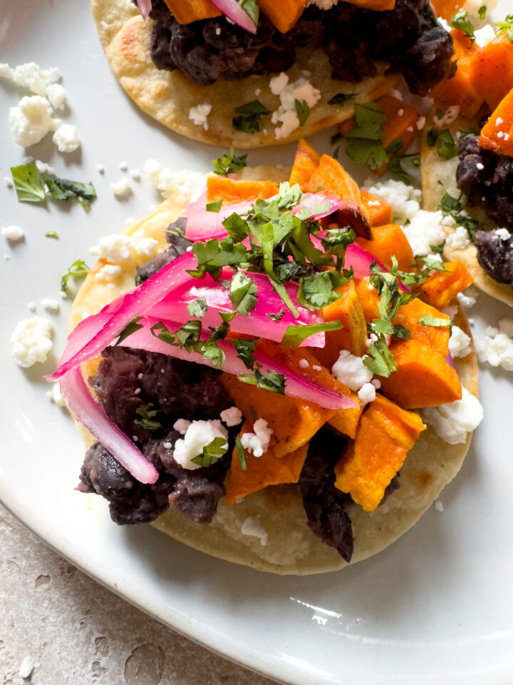 Top tostada with fresh cilantro
