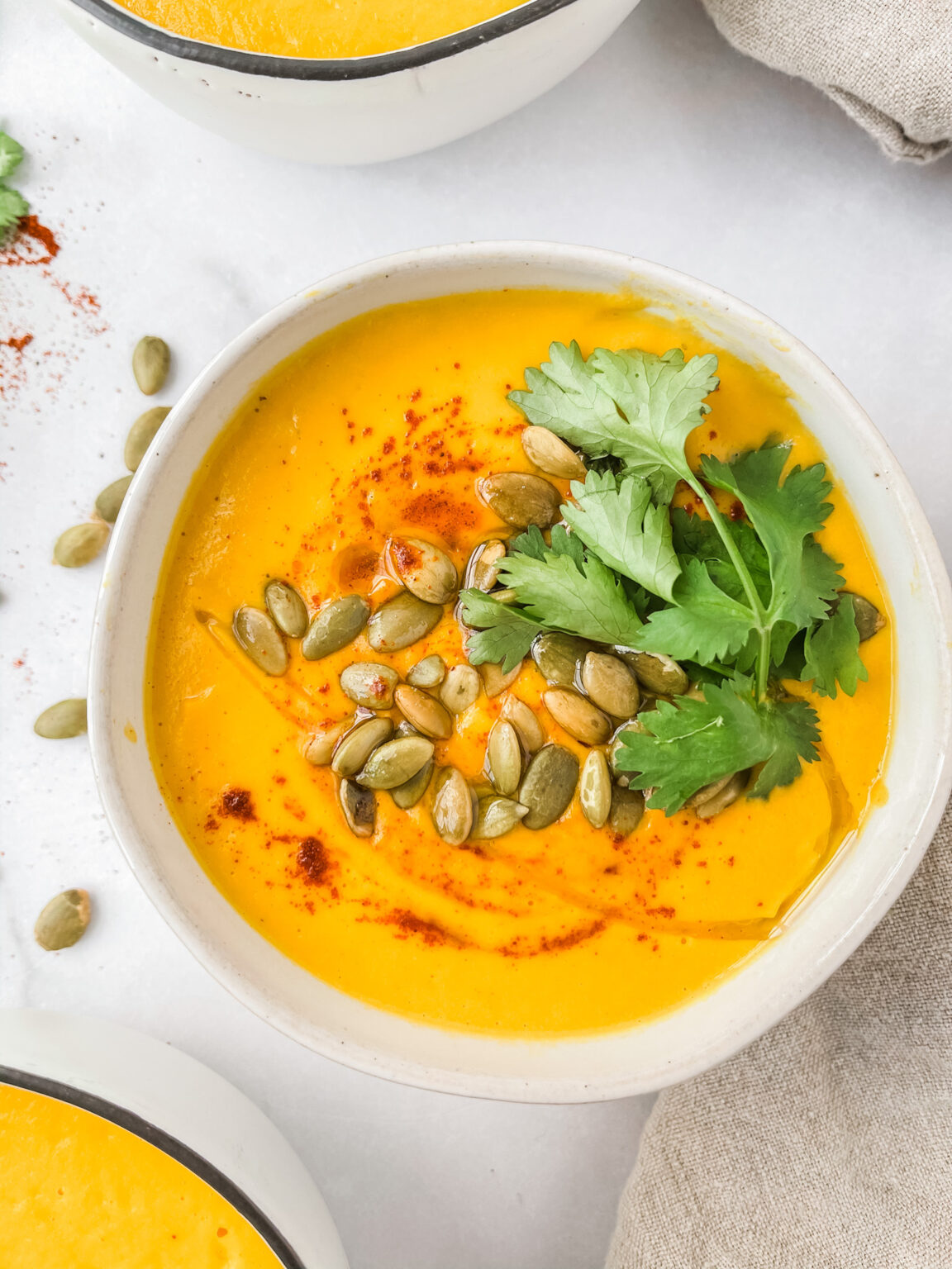 carrot cashew ginger soup with pepitas and coriander