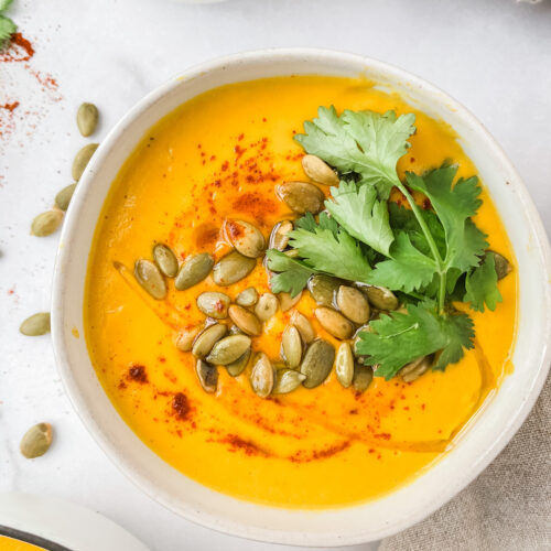 carrot cashew ginger soup with pepitas and coriander