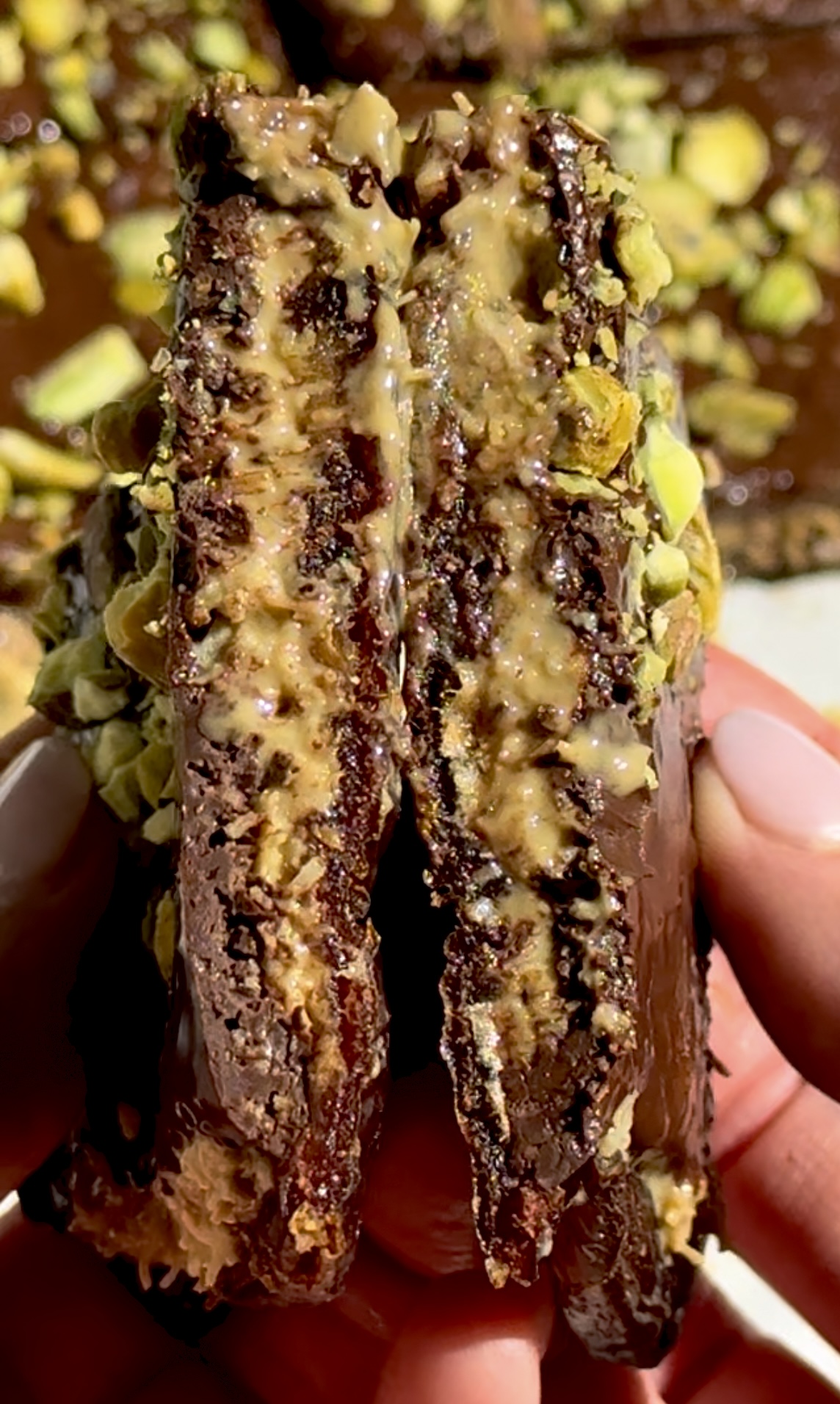 Dubai chocolate date bars with a creamy and crispy pistachio center.